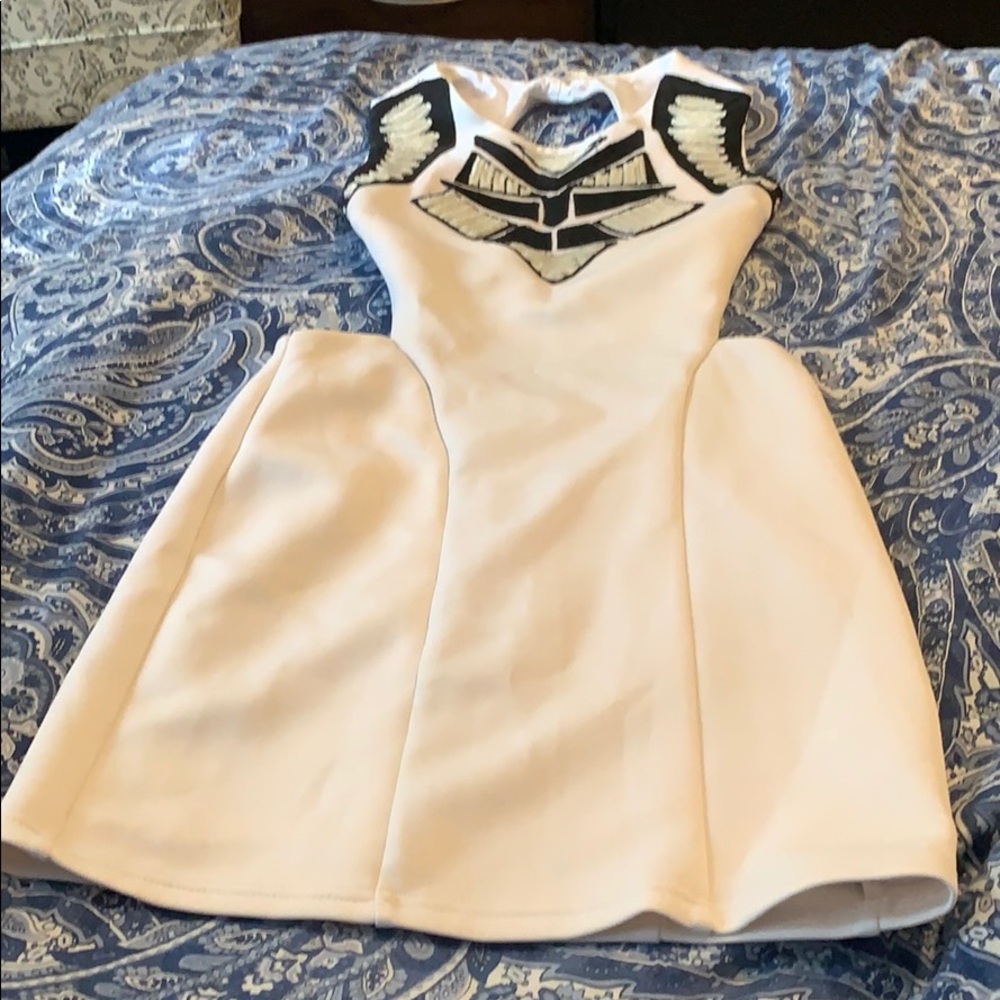 Black and white form fitted dress w/ cut out back